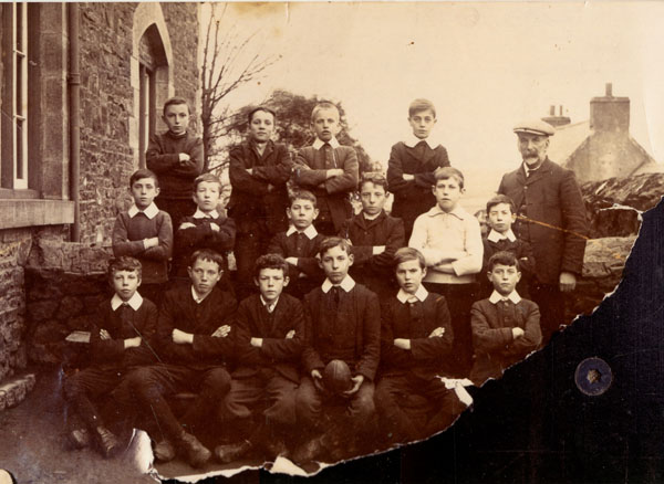 Copy of a photograph of Llangwm Pembrokeshire young footballers. Thomas Carr is named as the adult in the photograph